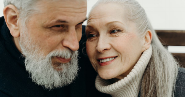 A joyful senior couple embracing warmly